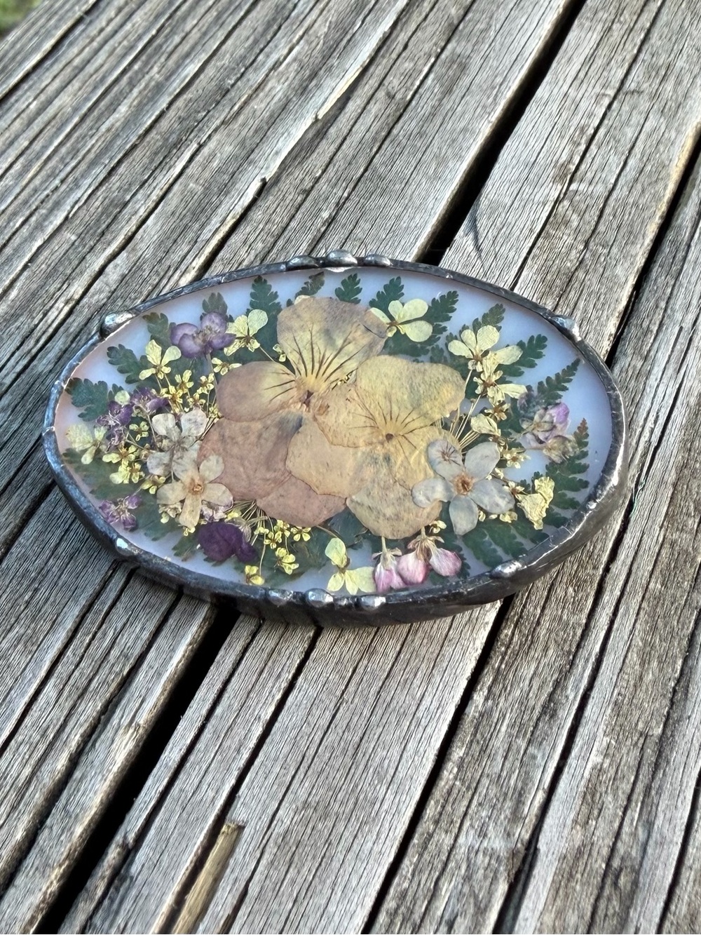 Soldered Metal Oval Dried Flowers Under Glass Over Milk Glass Brooch/Pin 2”